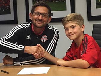 Toronto FC sign young fan with...